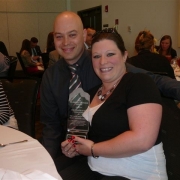 Austin and Chrissy Heim with big smiles after Chrissy receives the Florence Britzius Award!